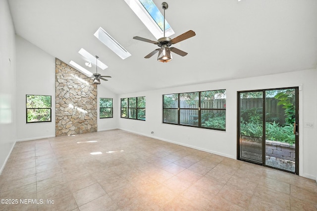1918 Oak Cir, Atlantic Beach, FL 32233 - empty room with ceiling fan, a skylight, high vaulted ceiling, and tile patterned floors