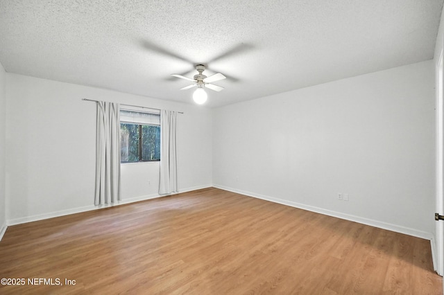 1918 Oak Cir, Atlantic Beach, FL 32233 - empty room with ceiling fan, light wood finished floors, and a textured ceiling