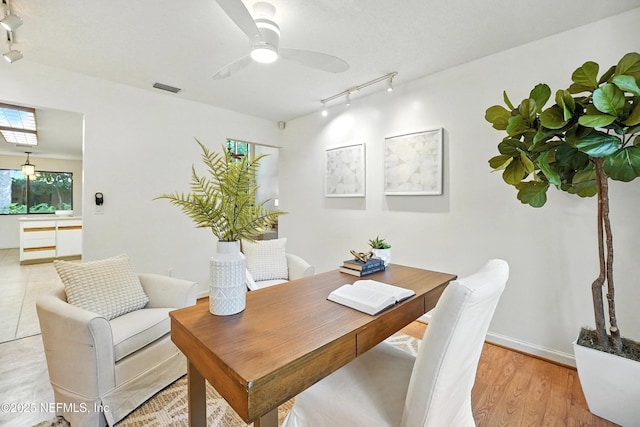 1918 Oak Cir, Atlantic Beach, FL 32233 - office with rail lighting, a ceiling fan, and light wood-type flooring