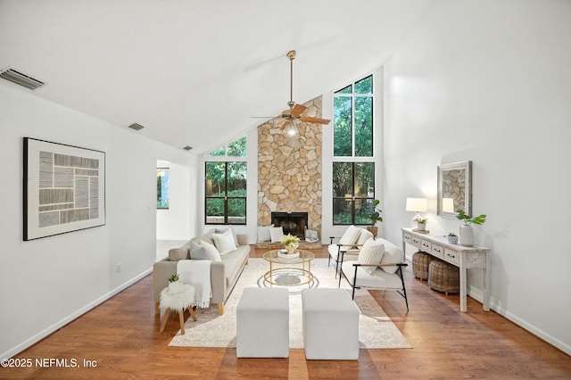 1918 Oak Cir, Atlantic Beach, FL 32233 - living area with high vaulted ceiling, ceiling fan, wood finished floors, and a stone fireplace