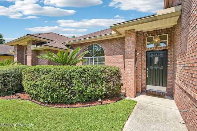 1400 Gibralter Ln, Fleming Island, FL 32003 - property entrance featuring brick siding and a lawn