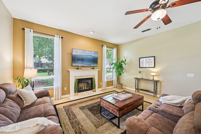 1400 Gibralter Ln, Fleming Island, FL 32003 - tiled living room featuring ceiling fan and a fireplace