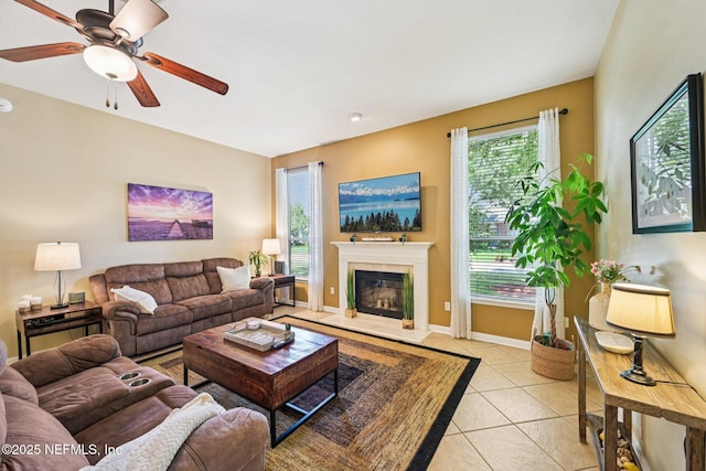 1400 Gibralter Ln, Fleming Island, FL 32003 - living room featuring ceiling fan, light tile patterned floors, and a glass covered fireplace