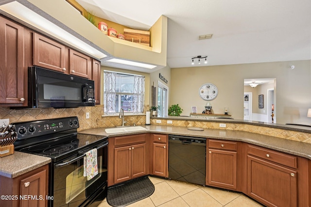 1400 Gibralter Ln, Fleming Island, FL 32003 - kitchen with black appliances, light tile patterned flooring, tasteful backsplash, and brown cabinets
