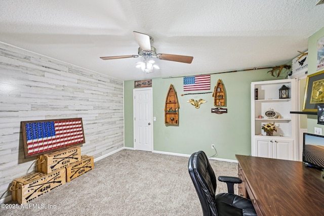 1400 Gibralter Ln, Fleming Island, FL 32003 - office featuring carpet floors, a textured ceiling, ceiling fan, an accent wall, and wooden walls
