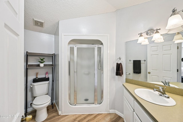 1400 Gibralter Ln, Fleming Island, FL 32003 - full bath featuring wood finished floors, a shower stall, vanity, and a textured ceiling