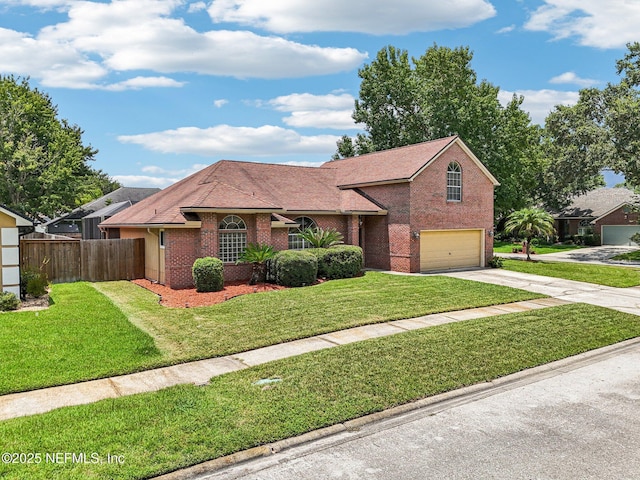 1400 Gibralter Ln, Fleming Island, FL 32003 - view of front of house with roof with shingles, driveway, a garage, and brick siding