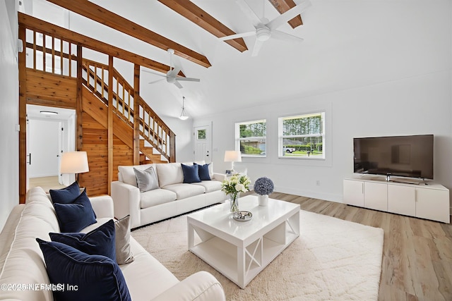 15 Katrina Pl, Palm Coast, FL 32164 - living room with ceiling fan, stairs, wood finished floors, beam ceiling, and high vaulted ceiling