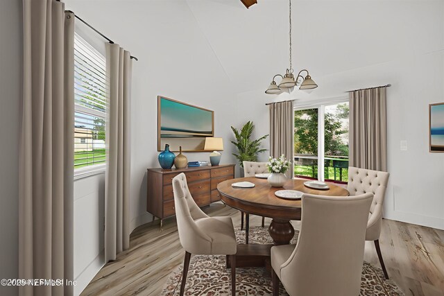 15 Katrina Pl, Palm Coast, FL 32164 - dining room featuring a chandelier and light wood finished floors