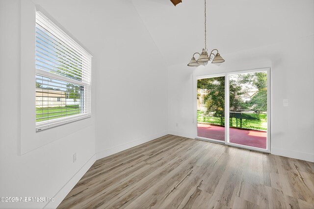 15 Katrina Pl, Palm Coast, FL 32164 - spare room with a chandelier and light wood-style floors
