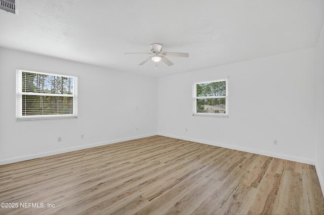 15 Katrina Pl, Palm Coast, FL 32164 - unfurnished room featuring healthy amount of natural light, a ceiling fan, and light wood finished floors