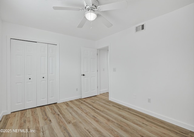 15 Katrina Pl, Palm Coast, FL 32164 - unfurnished bedroom featuring wood finished floors, a closet, and a ceiling fan