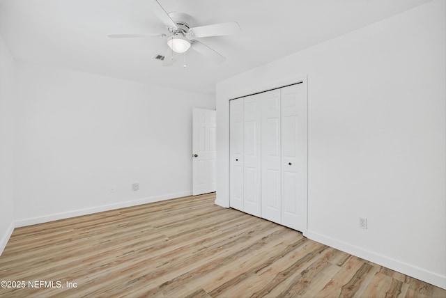 15 Katrina Pl, Palm Coast, FL 32164 - unfurnished bedroom with wood finished floors, a closet, and a ceiling fan