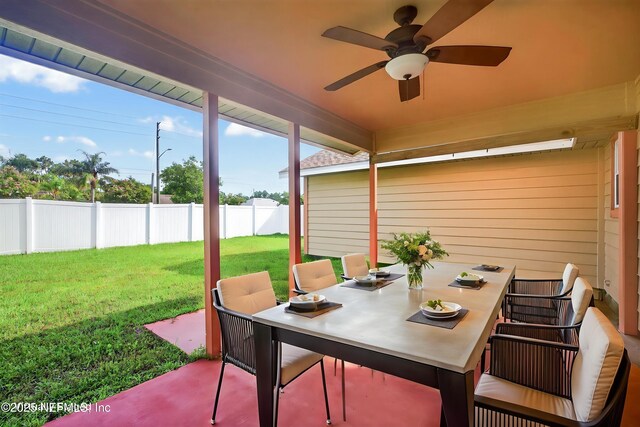 15 Katrina Pl, Palm Coast, FL 32164 - fenced backyard featuring ceiling fan, outdoor dining space, and a patio area