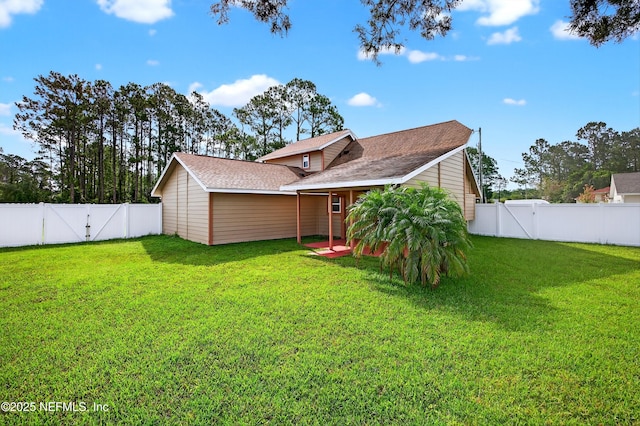 15 Katrina Pl, Palm Coast, FL 32164 - rear view of house with a gate and a fenced backyard