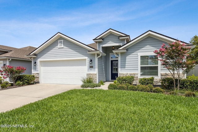 83316 Chapel Ct, Fernandina Beach, FL 32034 - view of front of house featuring stone siding, a garage, a front lawn, and concrete driveway