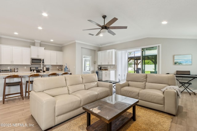 83316 Chapel Ct, Fernandina Beach, FL 32034 - living area featuring recessed lighting, light wood-type flooring, a ceiling fan, and ornamental molding