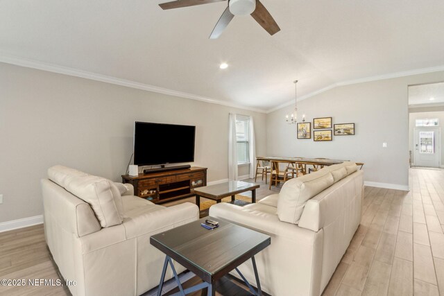 83316 Chapel Ct, Fernandina Beach, FL 32034 - living area featuring a chandelier, crown molding, light wood finished floors, a ceiling fan, and lofted ceiling