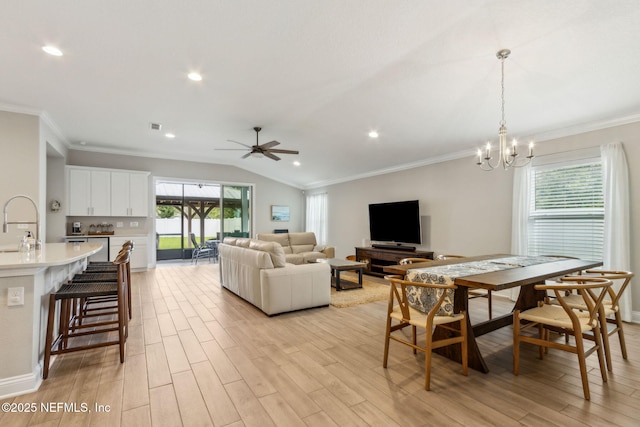 83316 Chapel Ct, Fernandina Beach, FL 32034 - dining room featuring light wood finished floors, ornamental molding, a chandelier, lofted ceiling, and ceiling fan