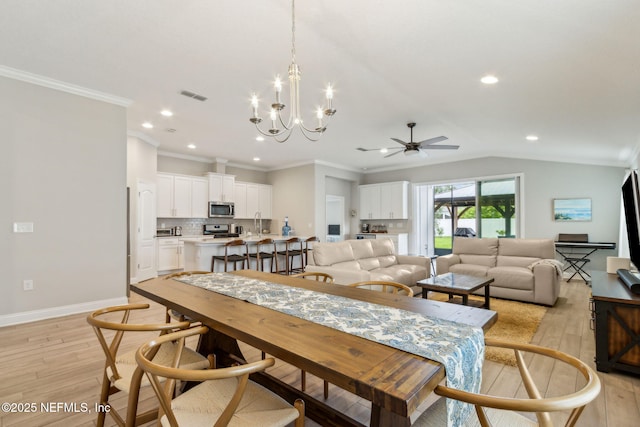 83316 Chapel Ct, Fernandina Beach, FL 32034 - dining area with light wood-style flooring, ceiling fan, recessed lighting, a chandelier, and ornamental molding