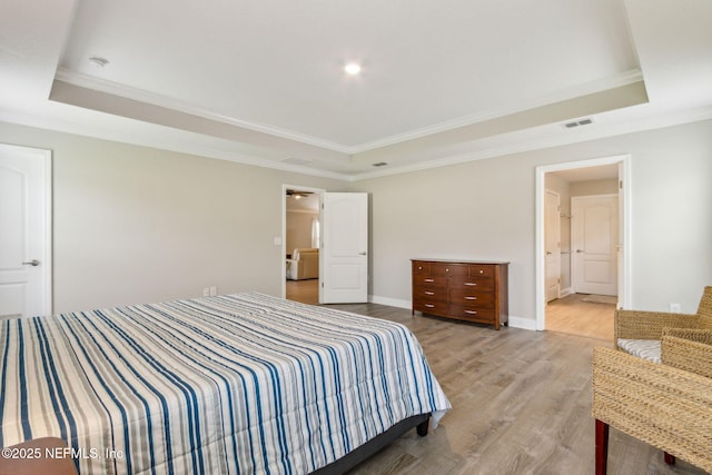 83316 Chapel Ct, Fernandina Beach, FL 32034 - bedroom with a raised ceiling, ornamental molding, and light wood-style flooring