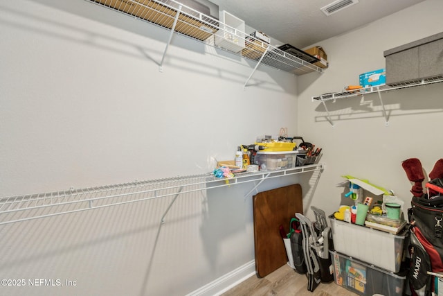 83316 Chapel Ct, Fernandina Beach, FL 32034 - walk in closet featuring wood finished floors