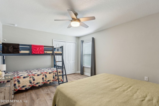 83316 Chapel Ct, Fernandina Beach, FL 32034 - bedroom featuring wood finished floors, a closet, ceiling fan, and a textured ceiling