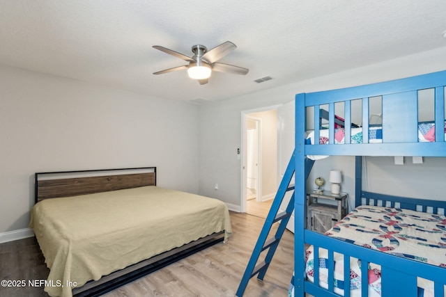 83316 Chapel Ct, Fernandina Beach, FL 32034 - bedroom with wood finished floors and a ceiling fan