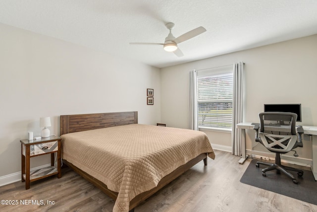 83316 Chapel Ct, Fernandina Beach, FL 32034 - bedroom featuring wood finished floors, ceiling fan, and an office area