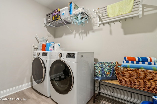 83316 Chapel Ct, Fernandina Beach, FL 32034 - laundry room with washer and clothes dryer and wood finished floors