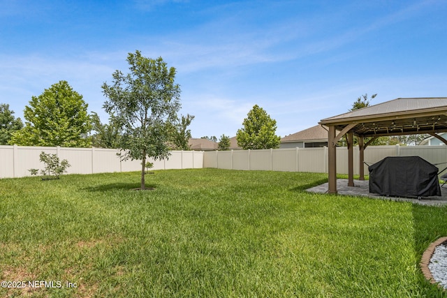 83316 Chapel Ct, Fernandina Beach, FL 32034 - fenced backyard featuring a gazebo and a patio