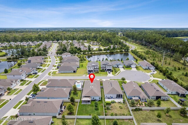 83316 Chapel Ct, Fernandina Beach, FL 32034 - aerial perspective of suburban area with a nearby body of water and a heavily wooded area
