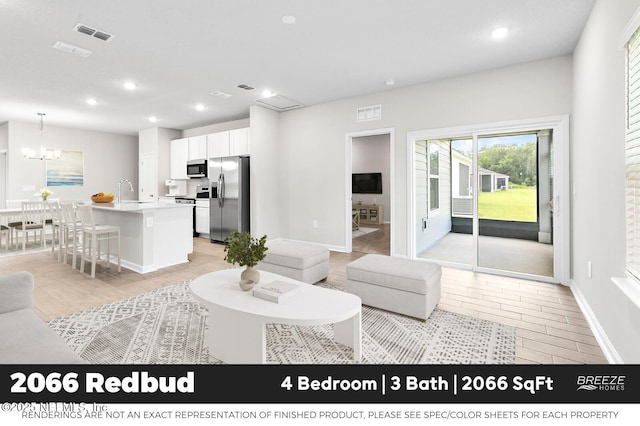 9018 Whinny Way Lot 276, Jacksonville, FL 32219 - living area with recessed lighting and a chandelier