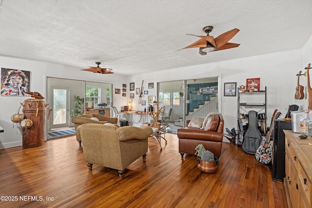 6241 Riviera Manor Dr, Jacksonville, FL 32216 - living area featuring ceiling fan, a textured ceiling, hardwood / wood-style flooring, and stairway