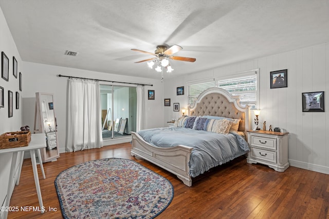 6241 Riviera Manor Dr, Jacksonville, FL 32216 - bedroom featuring access to exterior, wood finished floors, ceiling fan, and a textured ceiling