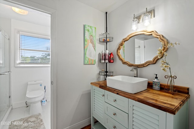 6241 Riviera Manor Dr, Jacksonville, FL 32216 - bathroom with vanity, an enclosed shower, and marble look tiles
