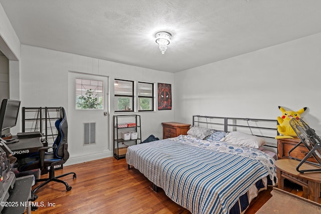 6241 Riviera Manor Dr, Jacksonville, FL 32216 - bedroom featuring wood finished floors and an office area