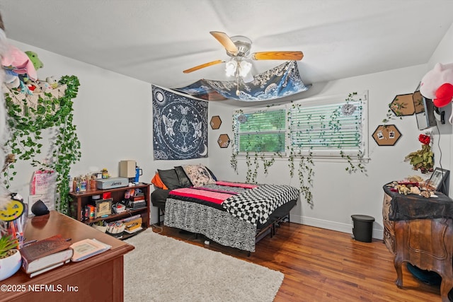6241 Riviera Manor Dr, Jacksonville, FL 32216 - bedroom featuring wood finished floors and a ceiling fan