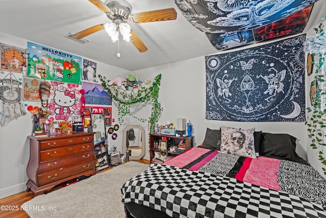 6241 Riviera Manor Dr, Jacksonville, FL 32216 - bedroom with wood finished floors and ceiling fan
