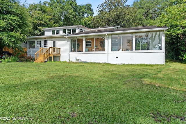 6241 Riviera Manor Dr, Jacksonville, FL 32216 - rear view of house with a sunroom, a yard, and stairway