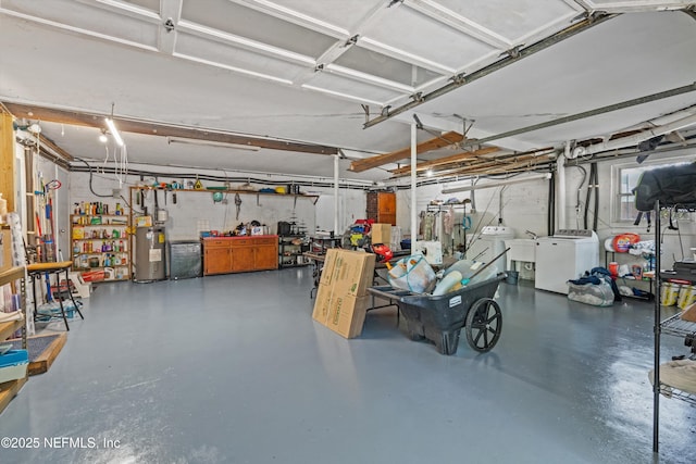 6241 Riviera Manor Dr, Jacksonville, FL 32216 - garage featuring water heater, washer and dryer, and a workshop area