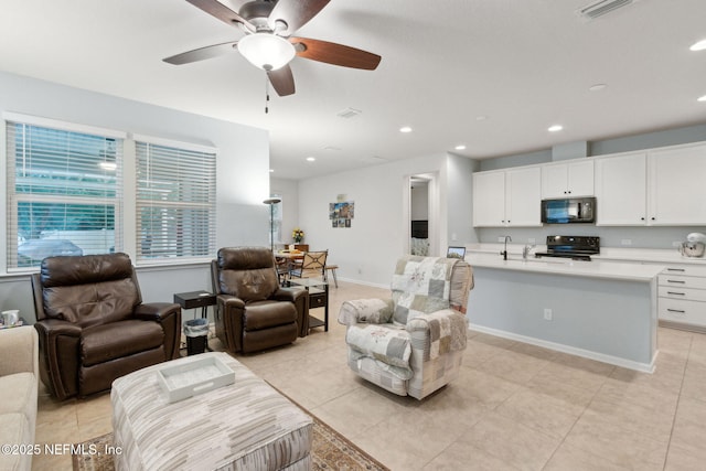 2972 Laurel Springs Dr, Green Cove Springs, FL 32043 - living room with light tile patterned floors, ceiling fan, and recessed lighting