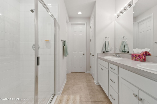 2972 Laurel Springs Dr, Green Cove Springs, FL 32043 - bathroom featuring double vanity, a stall shower, tile patterned floors, and recessed lighting