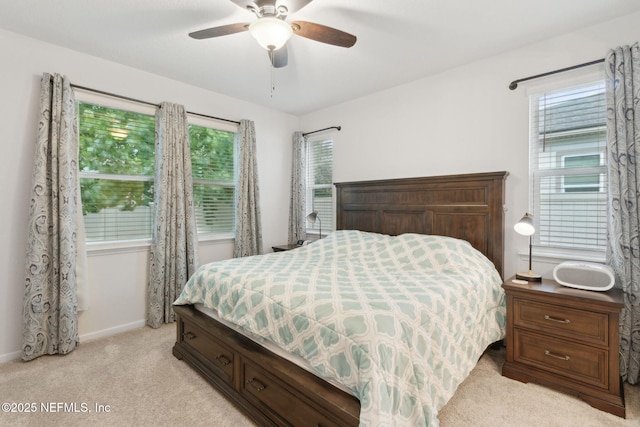 2972 Laurel Springs Dr, Green Cove Springs, FL 32043 - bedroom featuring light colored carpet, multiple windows, and a ceiling fan