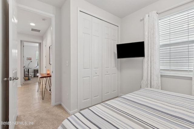 2972 Laurel Springs Dr, Green Cove Springs, FL 32043 - bedroom with a closet, light colored carpet, and light tile patterned floors
