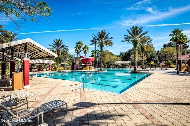 2972 Laurel Springs Dr, Green Cove Springs, FL 32043 - community pool featuring a water slide and a patio