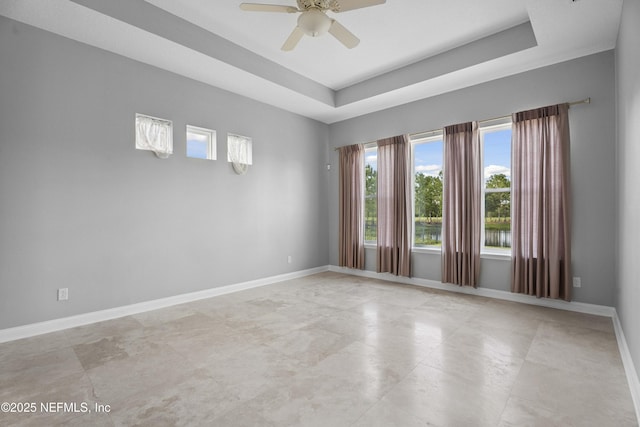 2936 Brettungar Dr, Jacksonville, FL 32246 - spare room featuring ceiling fan and a raised ceiling