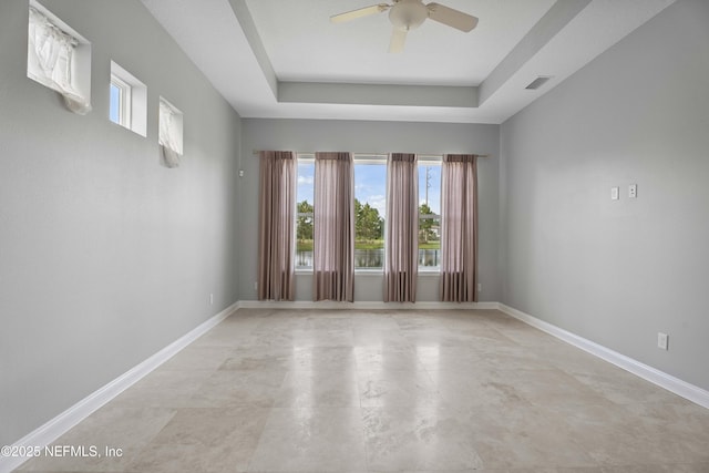 2936 Brettungar Dr, Jacksonville, FL 32246 - empty room featuring a ceiling fan and a raised ceiling