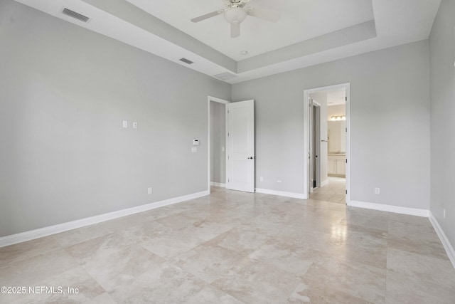 2936 Brettungar Dr, Jacksonville, FL 32246 - unfurnished bedroom featuring a raised ceiling, ensuite bath, and a ceiling fan