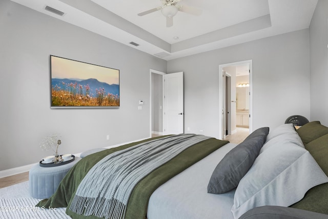 2936 Brettungar Dr, Jacksonville, FL 32246 - bedroom featuring a raised ceiling, ensuite bathroom, and ceiling fan